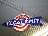 a sign that says tecalemit hanging from the ceiling