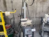 an image of a welding machine in a garage