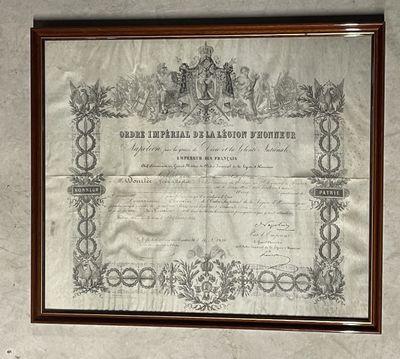 an old document is hanging on a wall in a room