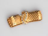 an image of a close up of a piece of jewelry on a white surface