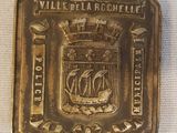 une image représentant une pièce d'or sur laquelle figure un bateau