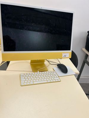 a computer on a desk with a keyboard and mouse