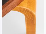 a close up of a wooden table with a black top
