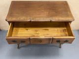 an old wooden dresser with two drawers and a drawer underneath it