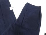 the bottom of a pair of blue pants with a tag on it