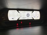 the dashboard of a car with a digital display on the dash