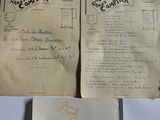 an old book with a handwritten page on it sitting on top of a table
