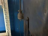 a machine that is sitting in a room with a blue wall