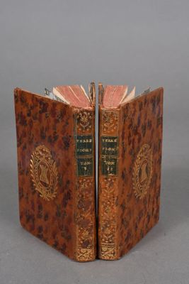 an old book is open to show the inside of it