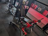a gym with a lot of equipment in the room