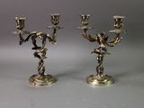 pair of antique silver plated candlesticks with angels on them
