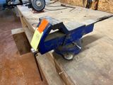 a blue vise with a yellow tag on it