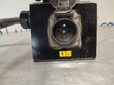 a black electrical outlet with a yellow tag on it