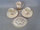 three cups and saucers sitting on a table next to each other