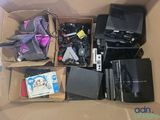 a cardboard box filled with electronics and other items
