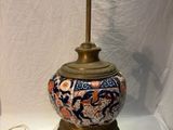 a lamp that is sitting on a table next to a lamp