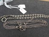 two silver chains with a silver clasp and a silver chain with a silver clasp and a silver chain with a silver clasp and a silver chain with a silver clasp