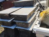 a sheep that is standing on a pile of boxes