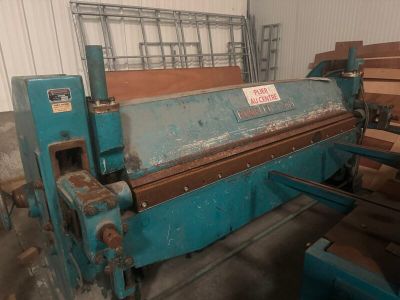 a blue machine that is sitting in a room