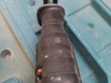 a drill that is sitting on top of a blue box