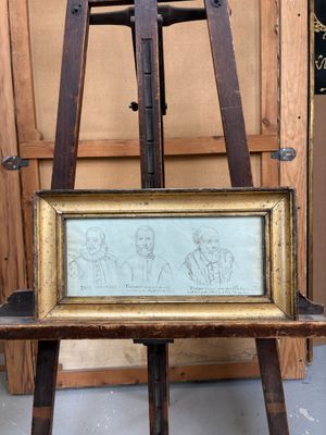 tableau représentant un homme et une femme devant un chevalet en bois