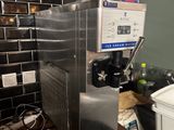 a machine that is sitting on a counter in a kitchen