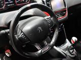 the interior of a car with a steering wheel and dashboard controls