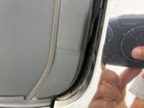 a man taking a picture of himself in the mirror of an airplane