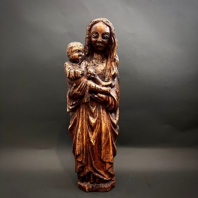 an image of a statue of a woman holding a child