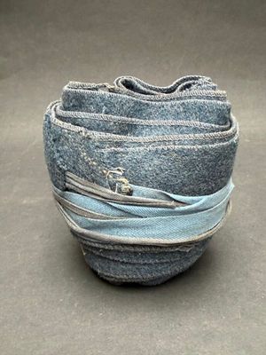 a stack of blue jeans stacked on top of each other