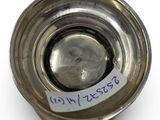a small metal object with a tag on it