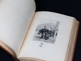 an open book with a picture of a group of people on it