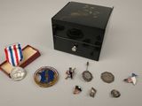 a small box with medals and a medal on it