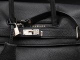 a close up of a black purse with a lock on it