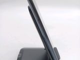 a cell phone that is sitting on top of a stand