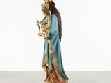 a statue of the virgin mary holding a child in her arms