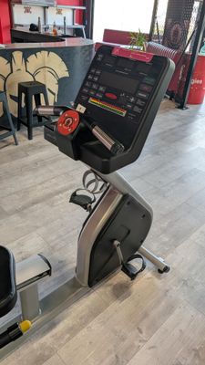 an image of a stationary exercise bike in a gym room