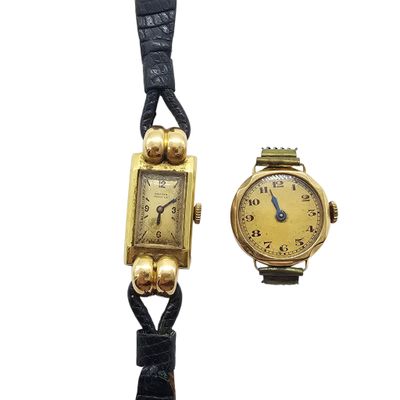 an image of a couple of wrist watches sitting next to each other