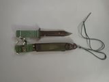 two different types of knives on a white surface