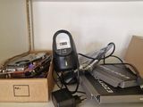 a desk with a lot of electronics on it