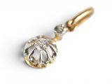 an image of a close up of a diamond pendant on a white surface