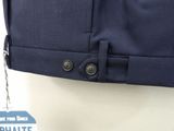 the back of a man ' s pants with a tag attached to it