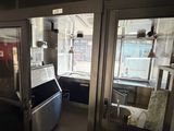 two glass doors that are open in a room