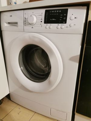 a washer and a dryer in a small kitchen