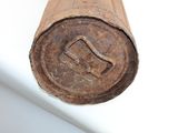 an old rusted pipe that is hanging from the ceiling