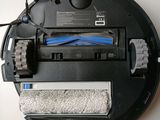 an image of a robotic vacuum cleaner with a cleaning cloth on it