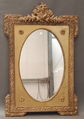 an image of a mirror with a gold frame on a grey background