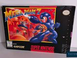 the box for the game mega manz is sitting on a table