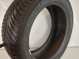 a close up of a tire on a white surface