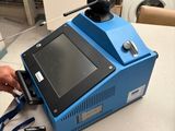 a blue machine that is sitting on a counter